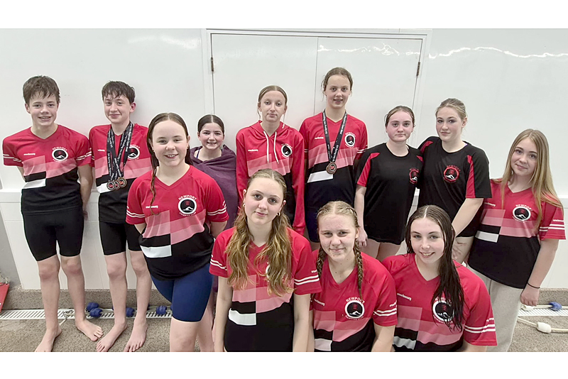 newport swimmers group photo with their medals