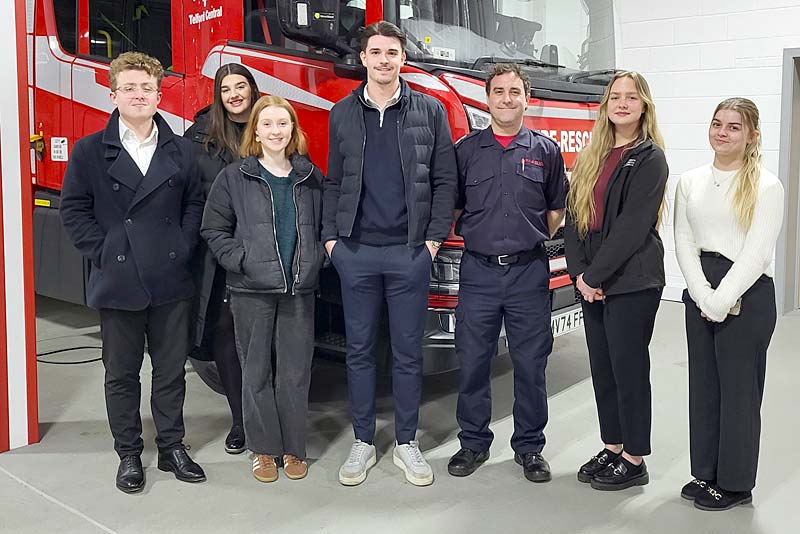 members with fire fighter in telford