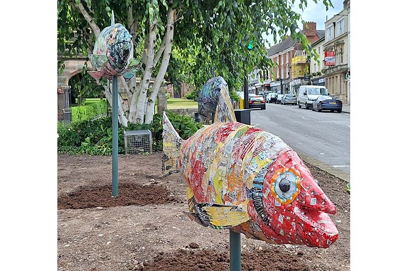 fish sculptures made from recycled cans